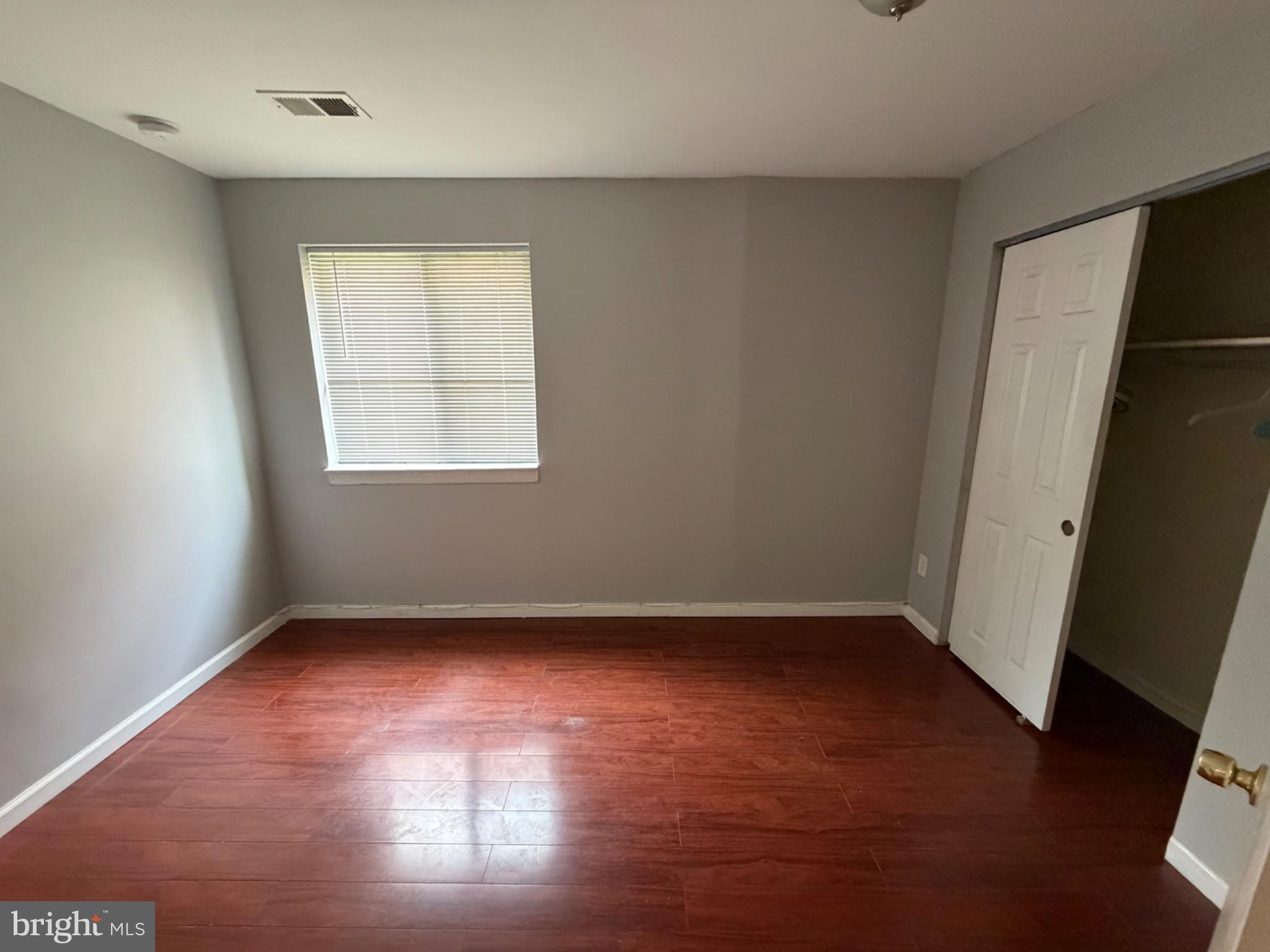 3273 Red Lion Road Philadelphia, PA 19114 - Photo 6 of 9 an empty room with wooden floor and windows