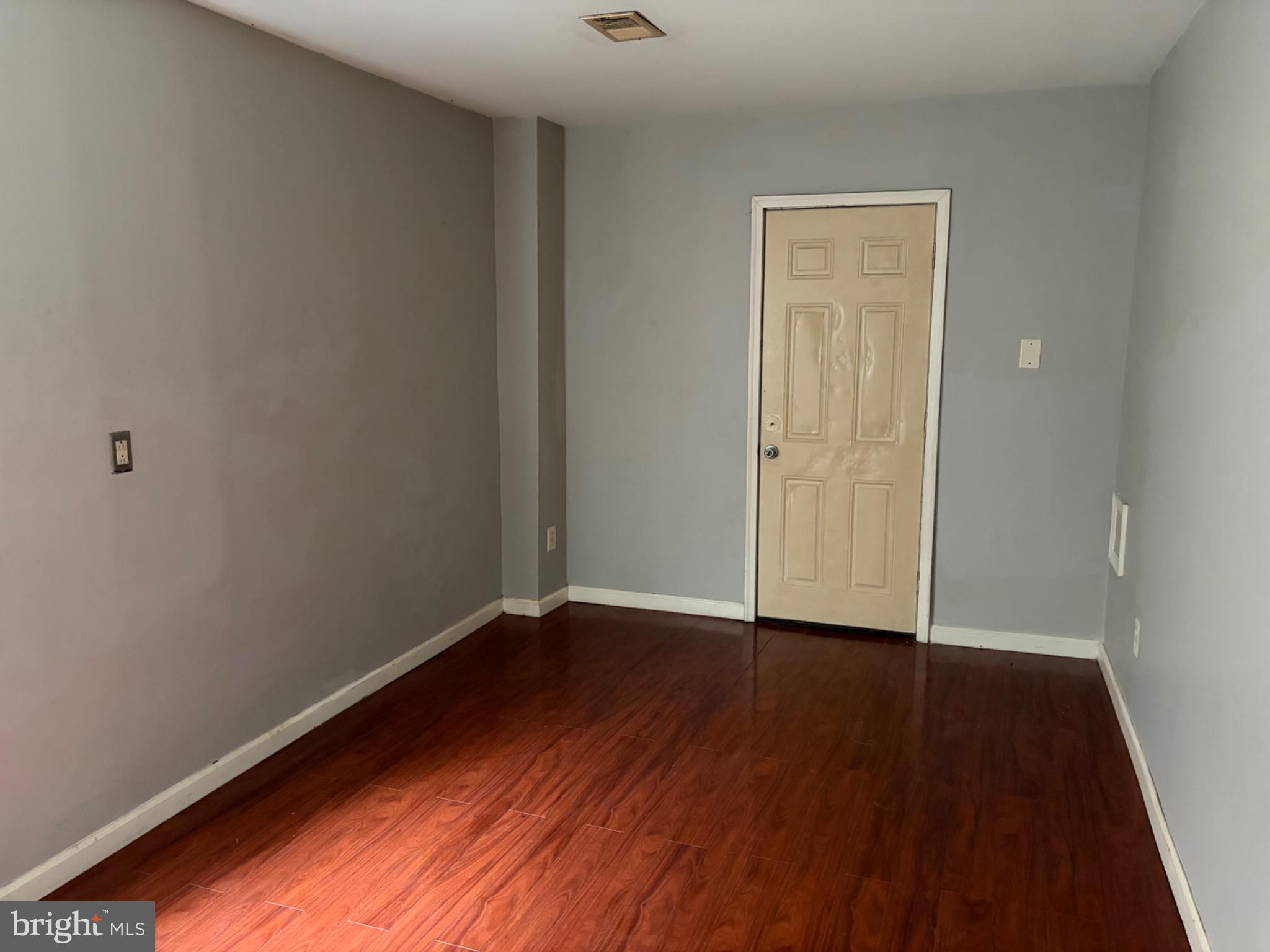 3273 Red Lion Road Philadelphia, PA 19114 - Photo 8 of 9 a view of an empty room with wooden floor and a window