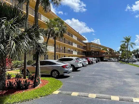 a view of a cars parked in front of a building