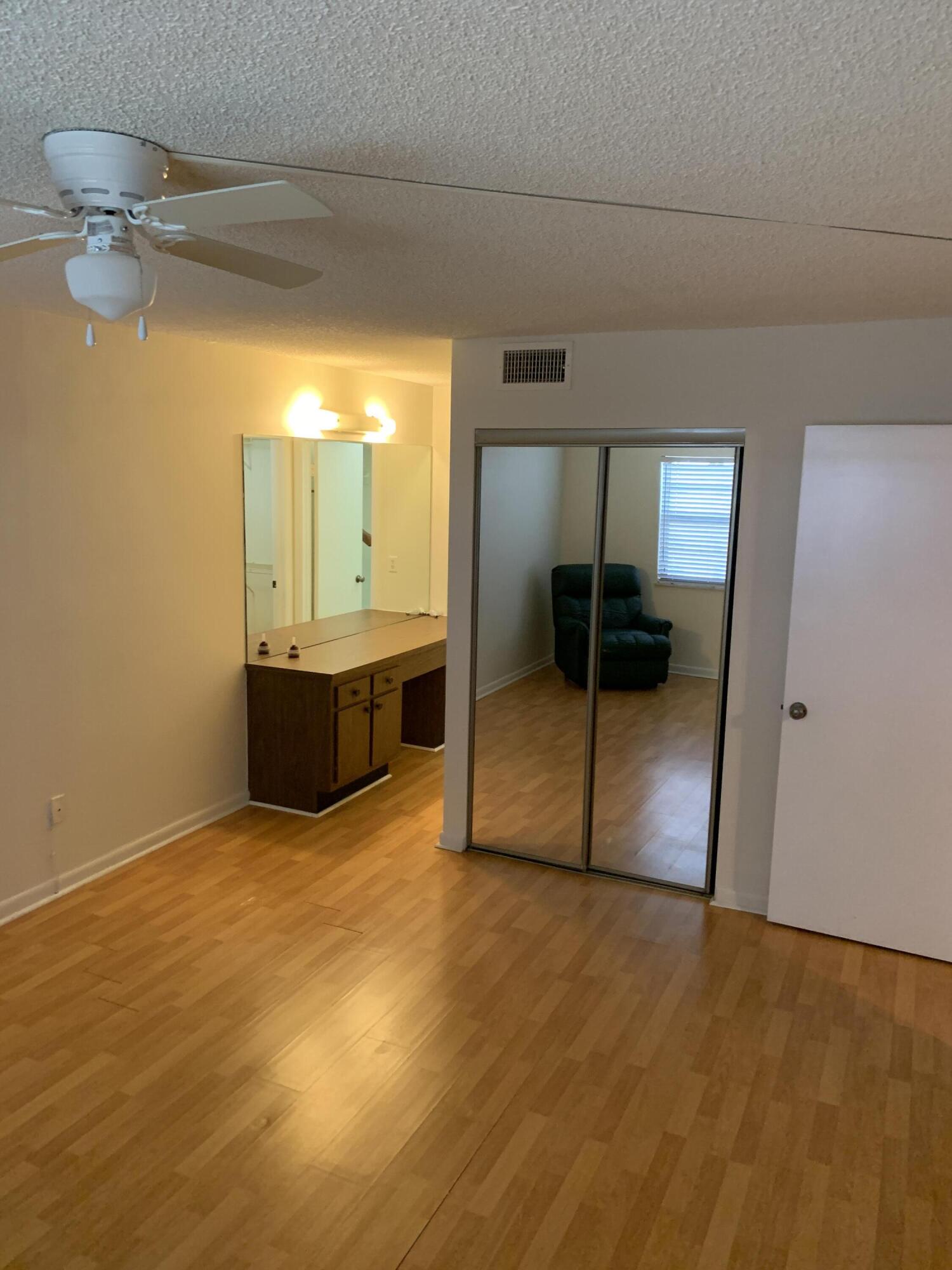 9273 Southwest 8th Street, Unit 416 Boca Raton, FL 33428 - Photo 8 of 14 a view of an empty room and window