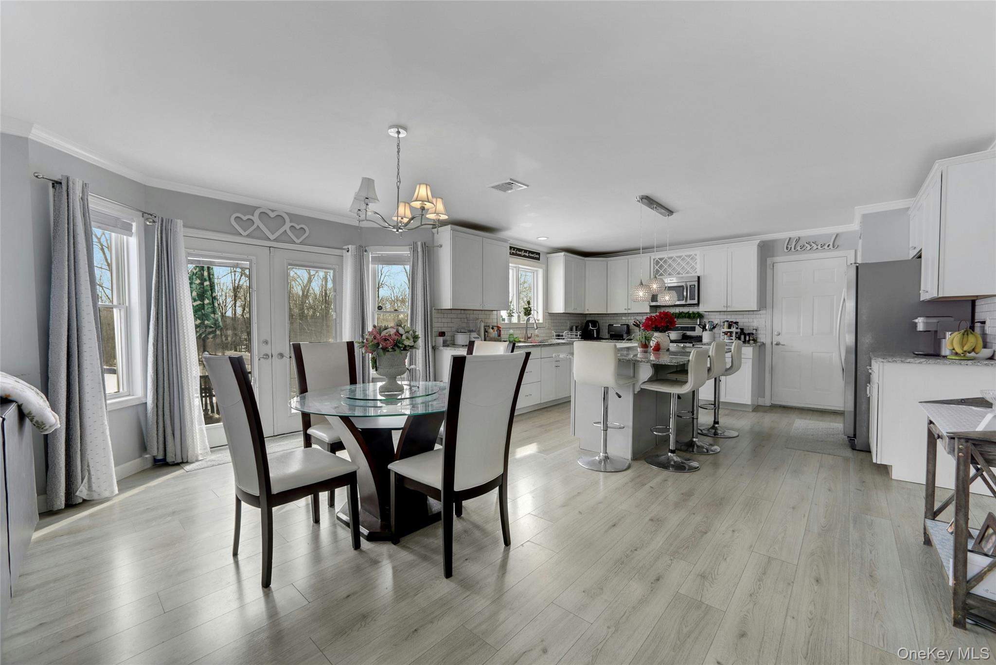 7 Angela's Way Goshen, NY 10924 - Photo 10 of 45 Dining room with ornamental molding, hanging lights, and light wood-style floors