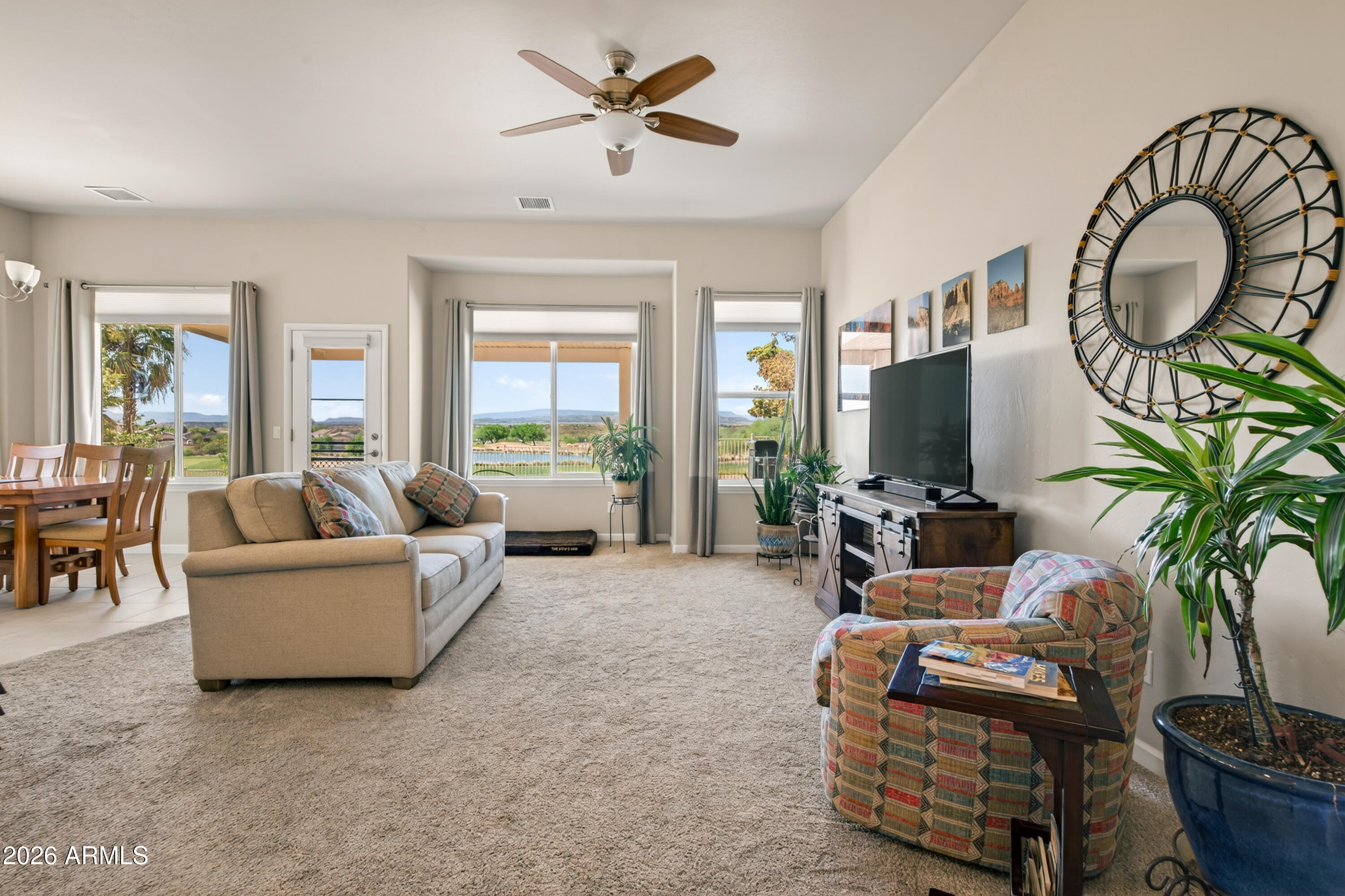 718 South Wandering River Road Cornville, AZ 86325 - Photo 6 of 41 a living room with furniture a large window with outer view
