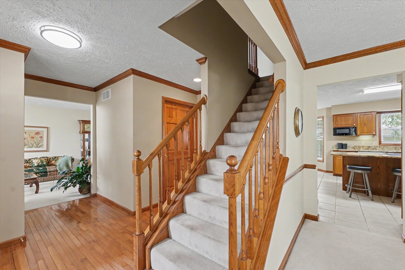 4409 Copper Ridge Road Champaign, IL 61822 - Photo 5 of 40 a view of entryway and hall with wooden floor