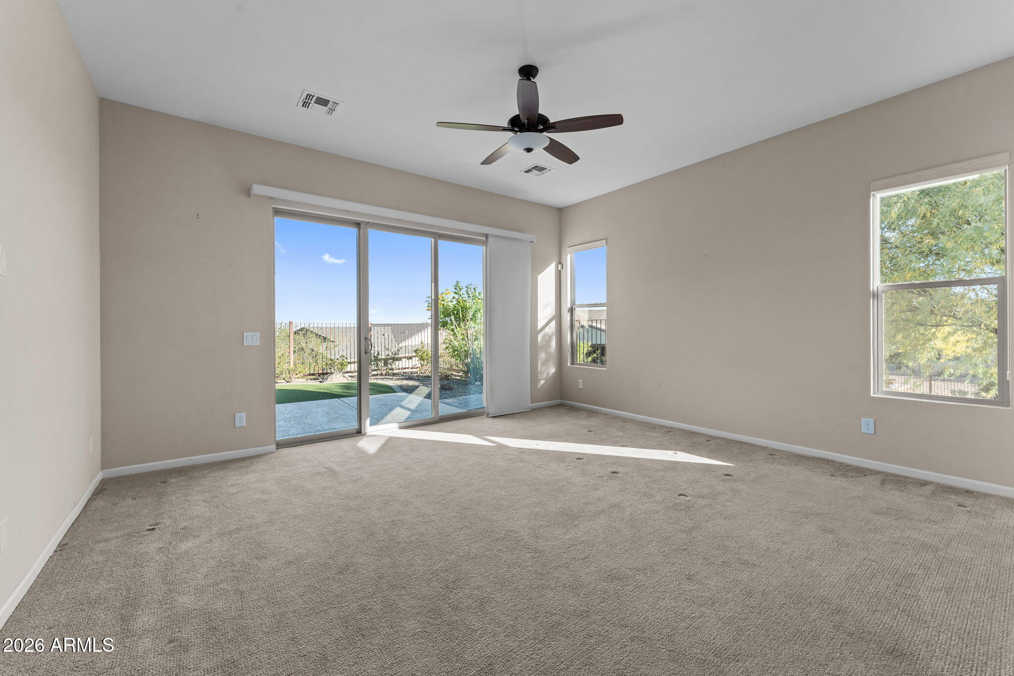 3675 Gold Ridge Road Wickenburg, AZ 85390 - Photo 3 of 58 a view of an empty room with a window