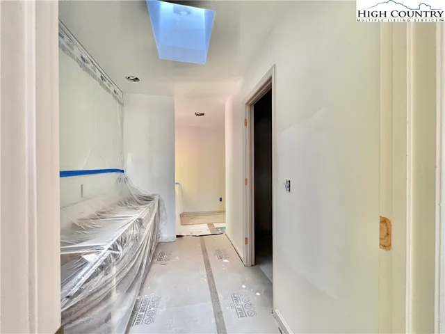 a bathroom with a granite countertop sink and a shower