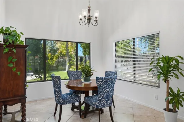 a view of a dining room with furniture window and outside view