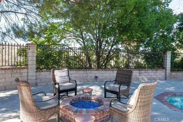 a backyard of a house with outdoor seating