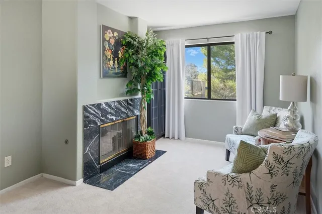 a bedroom with furniture and a potted plant