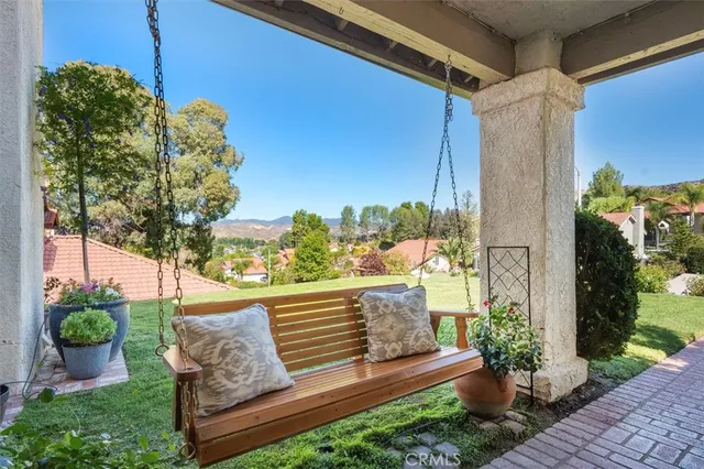 a view of a bench in the backyard