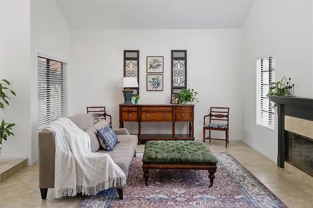 a bedroom with furniture and a rug