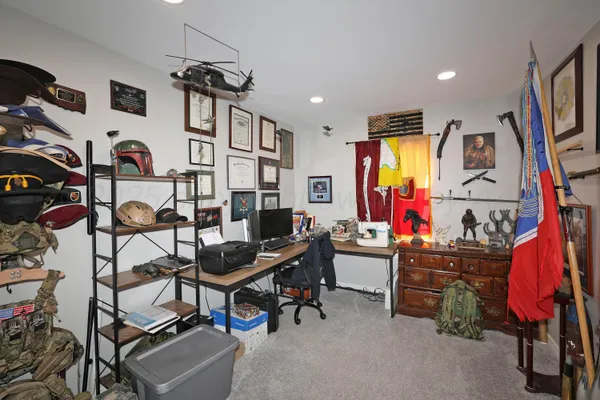 a view of a room with lots of stuff and furniture