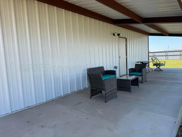 a living room with furniture and window