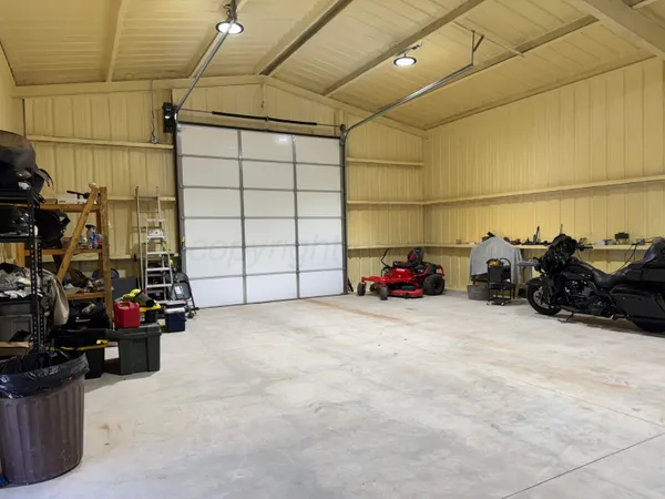 a view of a garage with cars