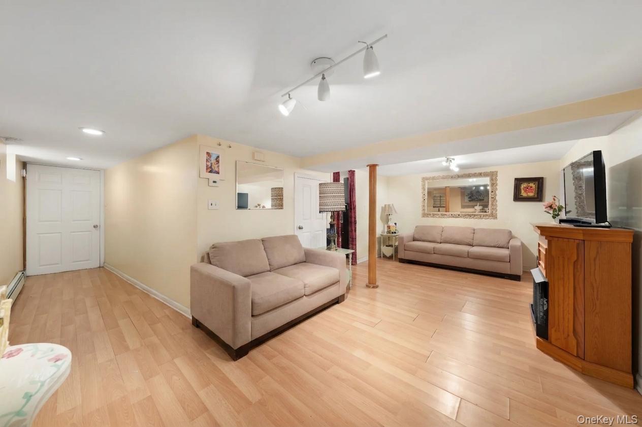 29-10 Butler Street Queens, NY 11369 - Photo 25 of 41 basement sitting room