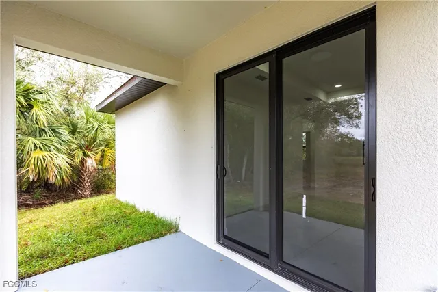 a view of a glass door of a house