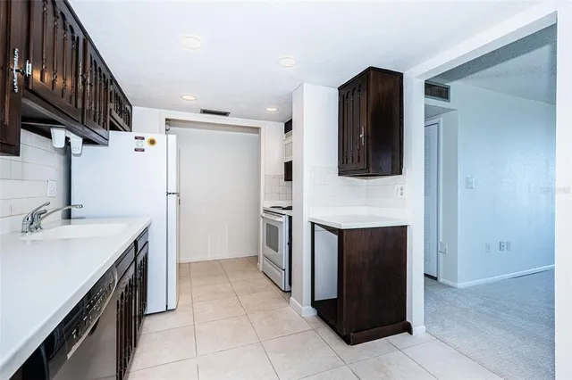 a kitchen with a stove and a refrigerator