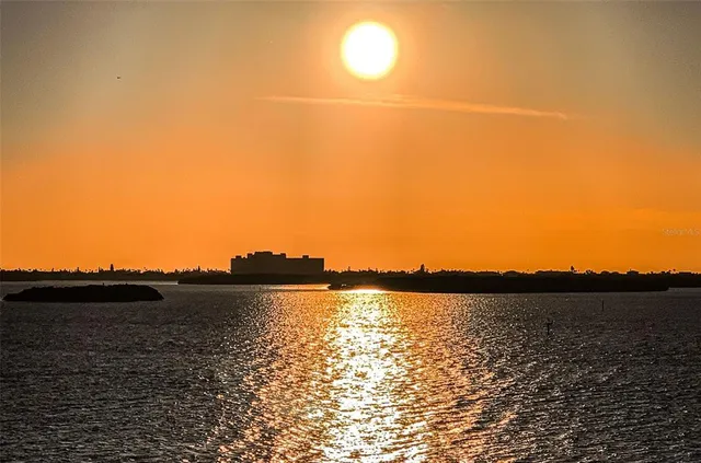 a view of ocean with sunset