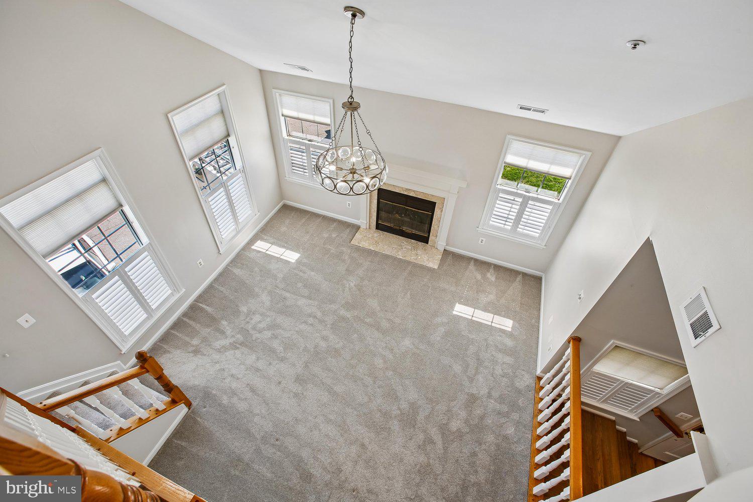 403 Fortress Way, Unit 403 Occoquan, VA 22125 - Photo 16 of 66 a view of an empty room with windows and fireplace