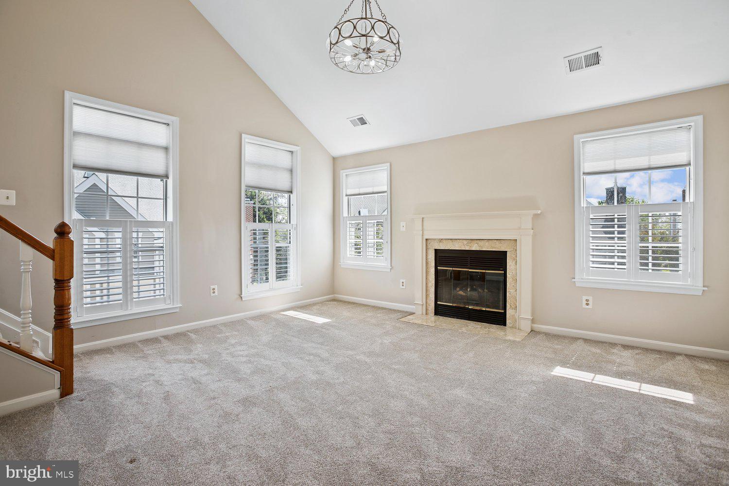 403 Fortress Way, Unit 403 Occoquan, VA 22125 - Photo 19 of 66 an empty room with windows cabinet and fireplace