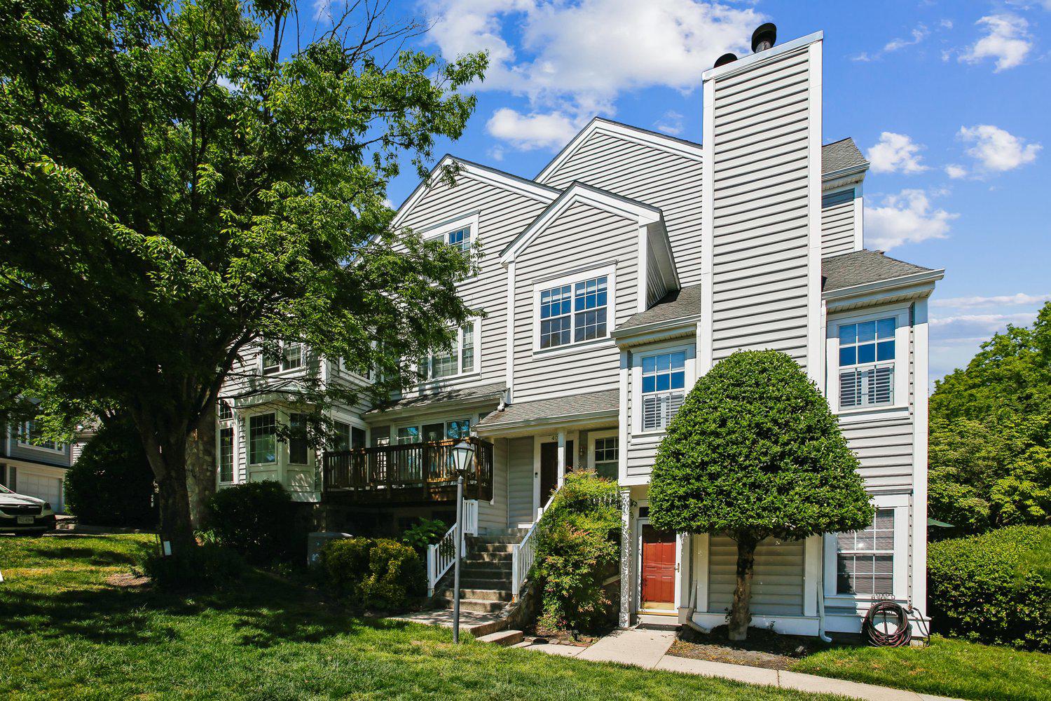 403 Fortress Way, Unit 403 Occoquan, VA 22125 - Photo 2 of 66 a front view of a house with garden