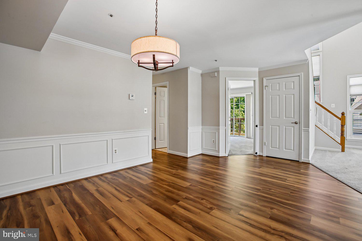 403 Fortress Way, Unit 403 Occoquan, VA 22125 - Photo 22 of 66 a view of an empty room with wooden floor and window