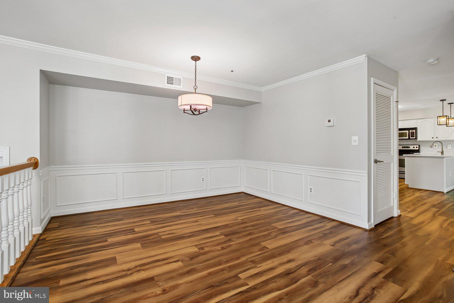 403 Fortress Way, Unit 403 Occoquan, VA 22125 - Photo 23 of 66 wooden floor in an empty room with a window