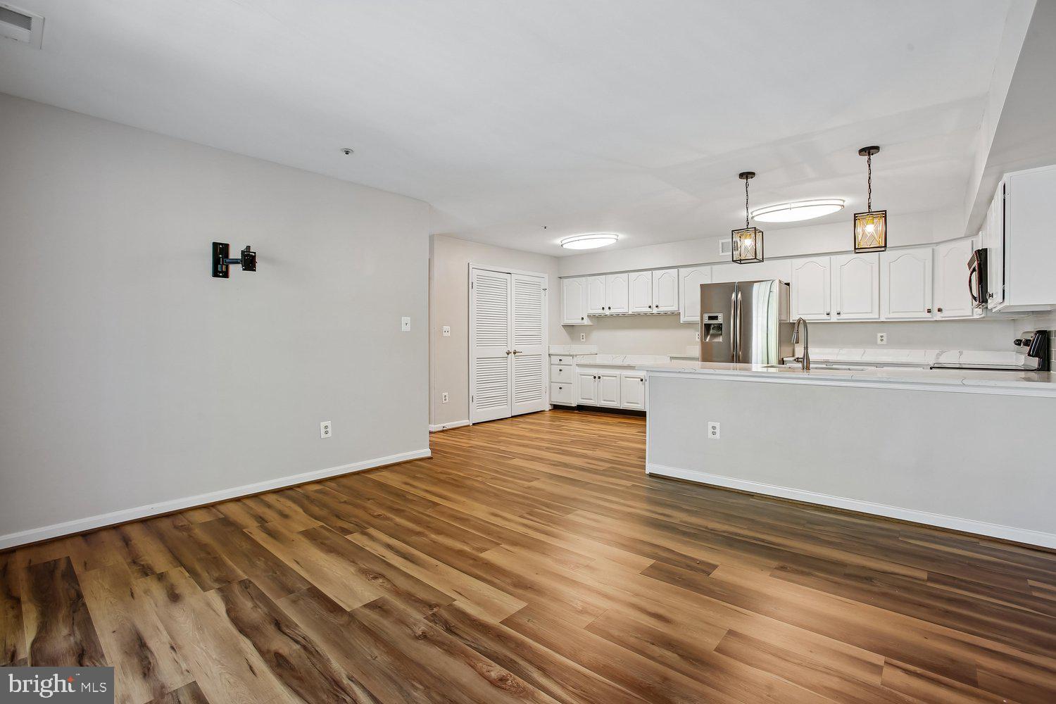 403 Fortress Way, Unit 403 Occoquan, VA 22125 - Photo 33 of 66 a view of kitchen with wooden floor