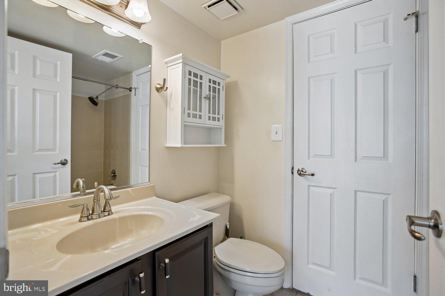 403 Fortress Way, Unit 403 Occoquan, VA 22125 - Photo 44 of 66 a bathroom with a sink a toilet and shower