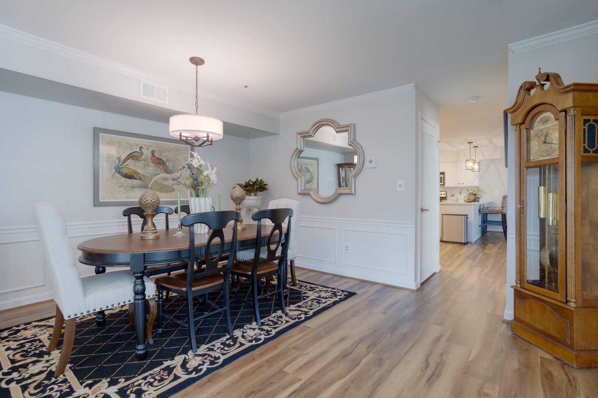 403 Fortress Way, Unit 403 Occoquan, VA 22125 - Photo 5 of 66 a view of a dining room with furniture wooden floor and chandelier