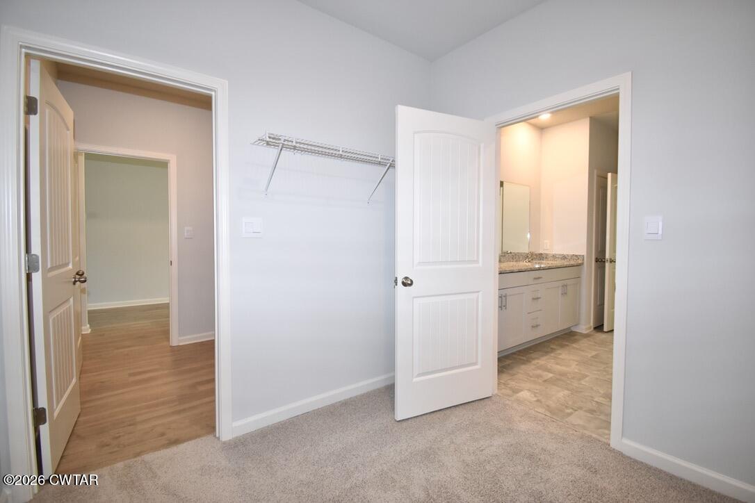 15 Chadro Cove Jackson, TN 38305 - Photo 13 of 25 Primary Closet to Laundry Room