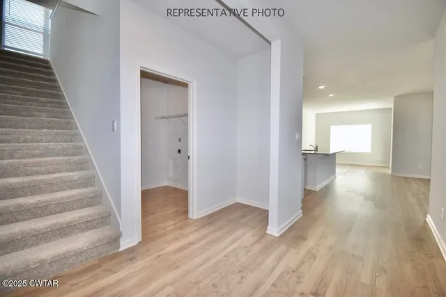 a view of entryway with wooden floor