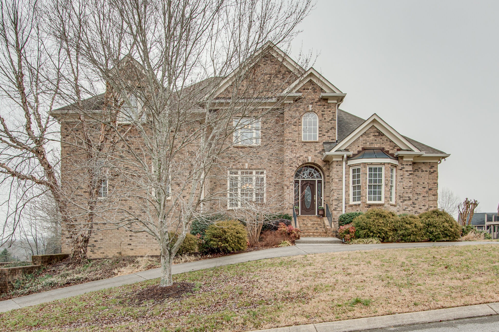 416 Sandcastle Road Franklin, TN 37069 - Photo 1 of 57 a front view of a house with garden