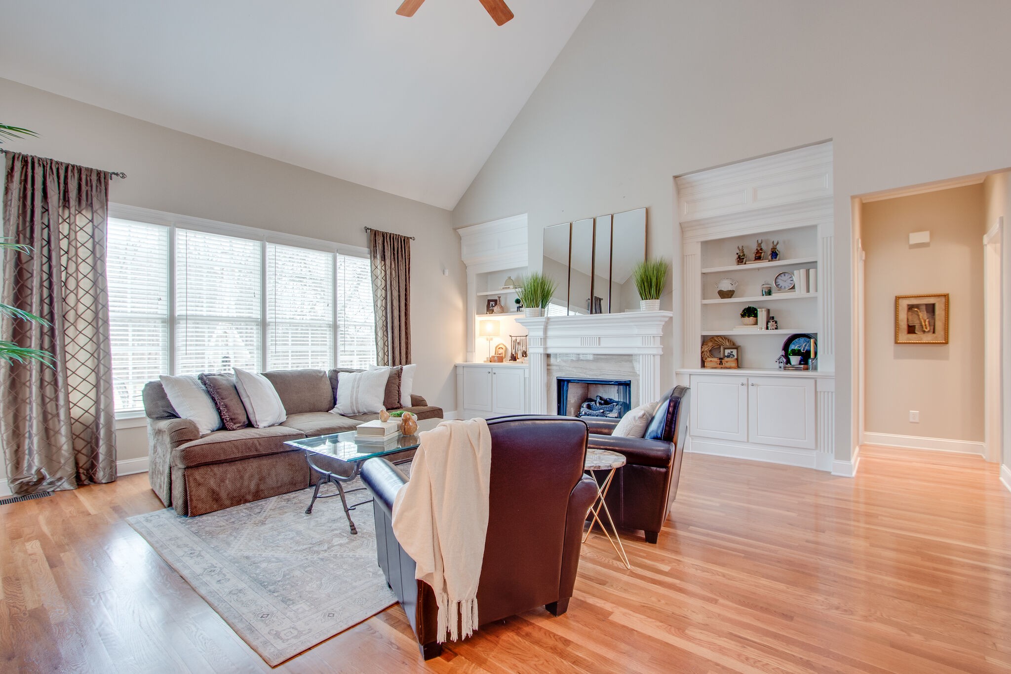 416 Sandcastle Road Franklin, TN 37069 - Photo 12 of 57 a living room with fireplace furniture and a large window