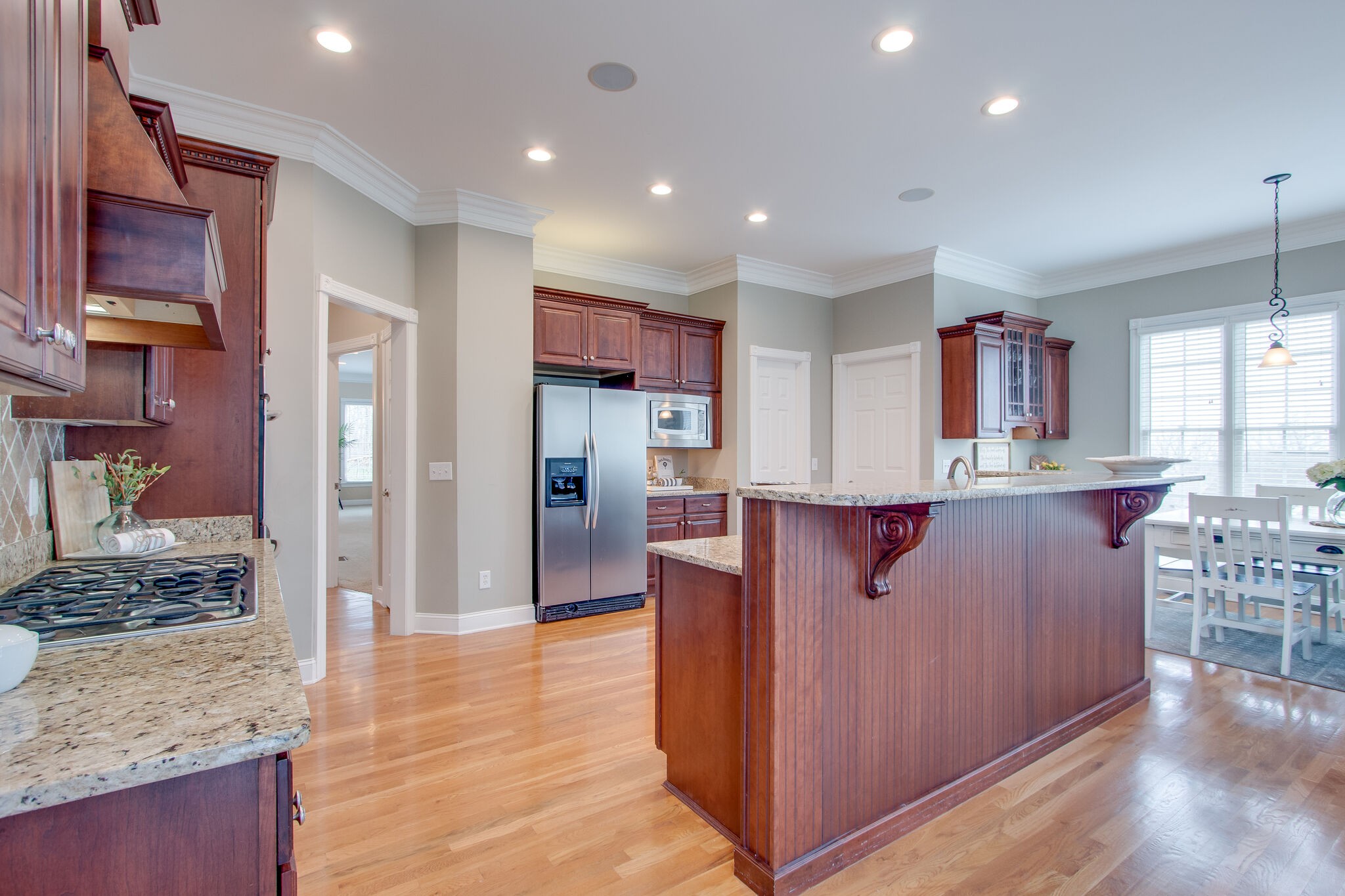 416 Sandcastle Road Franklin, TN 37069 - Photo 17 of 57 a kitchen with stainless steel appliances granite countertop a refrigerator and a stove top oven