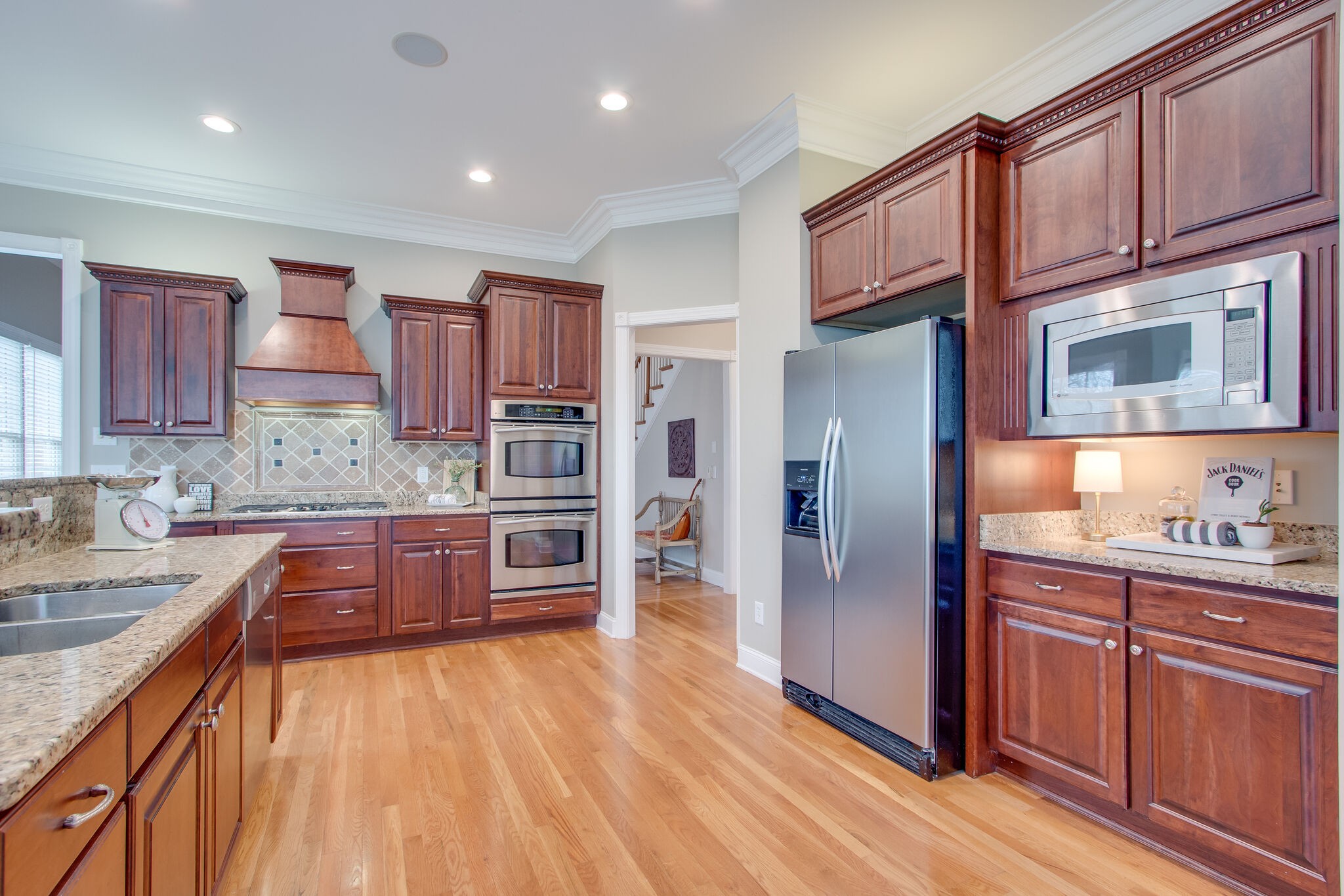 416 Sandcastle Road Franklin, TN 37069 - Photo 19 of 57 a kitchen with stainless steel appliances granite countertop a refrigerator stove and sink