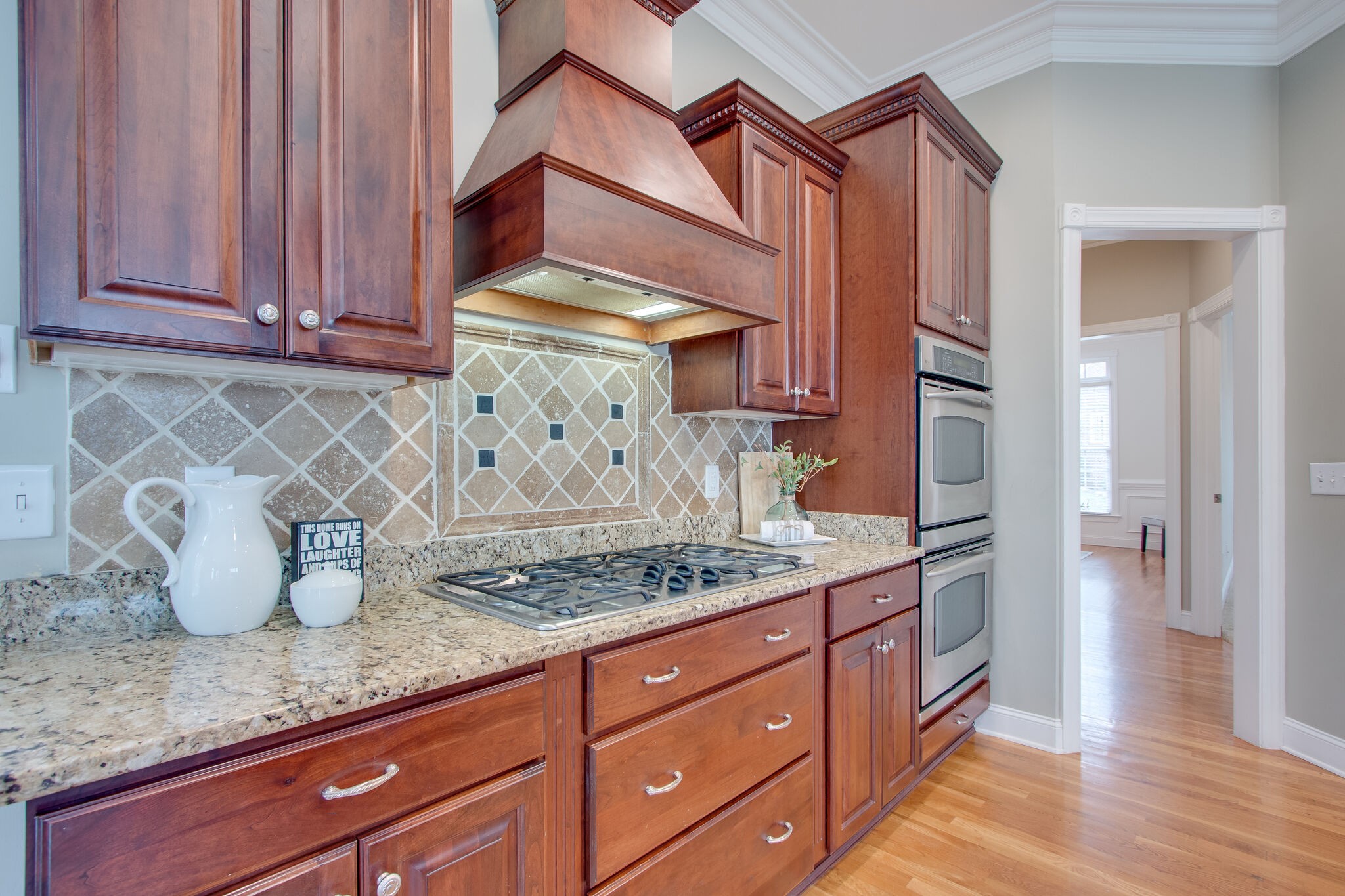 416 Sandcastle Road Franklin, TN 37069 - Photo 22 of 57 a kitchen with granite countertop a stove and cabinets