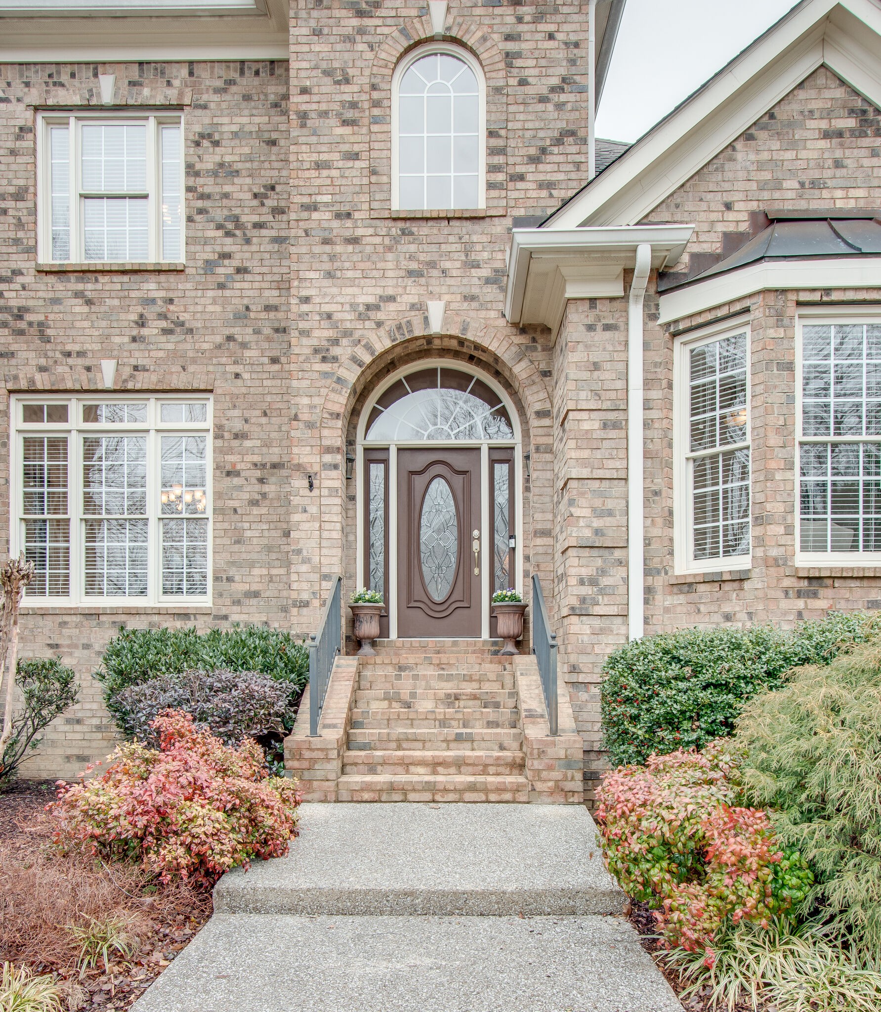 416 Sandcastle Road Franklin, TN 37069 - Photo 3 of 57 a front view of a house with a garden