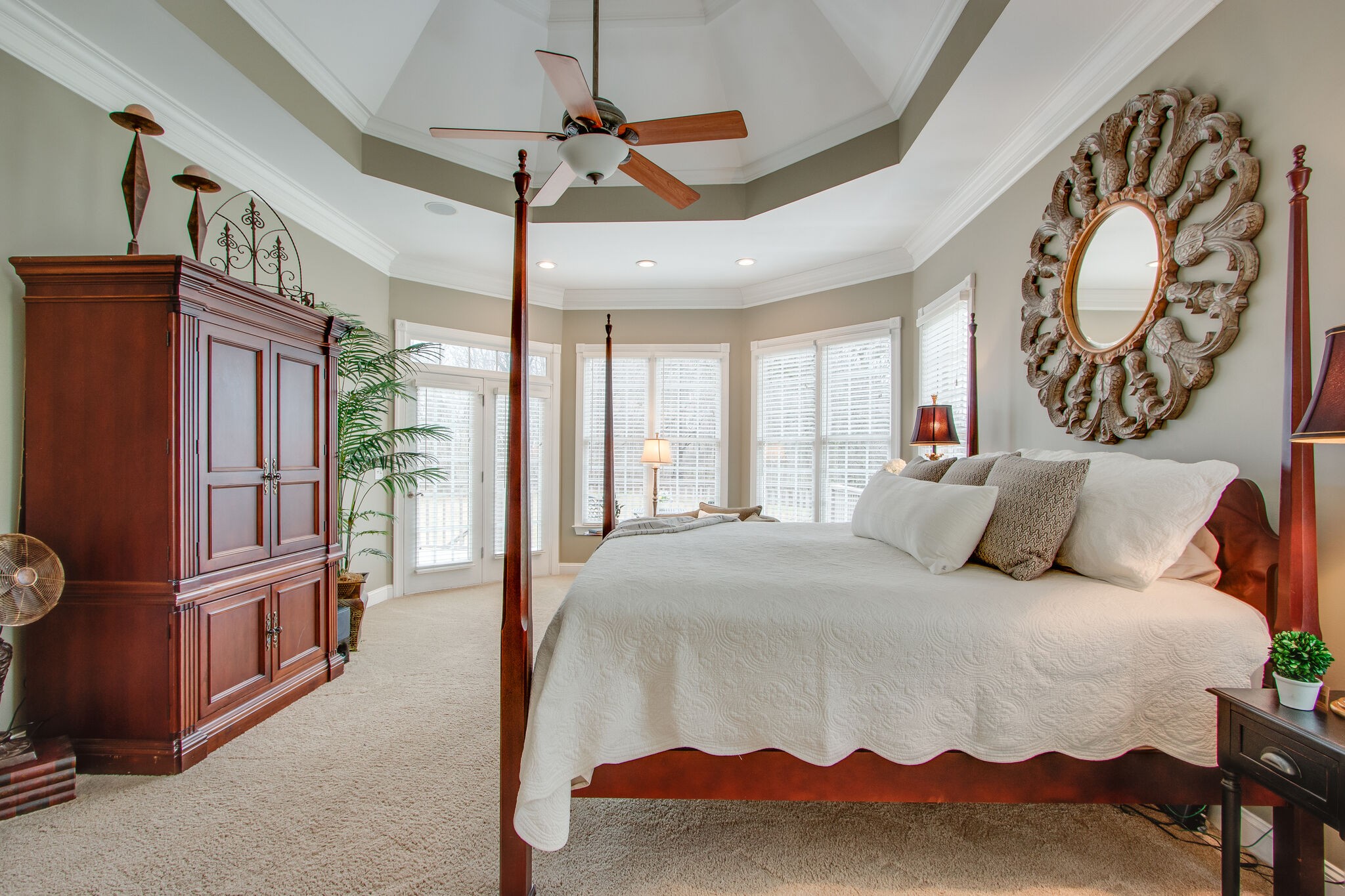 416 Sandcastle Road Franklin, TN 37069 - Photo 31 of 57 a spacious bedroom with a bed a dresser and a chandelier