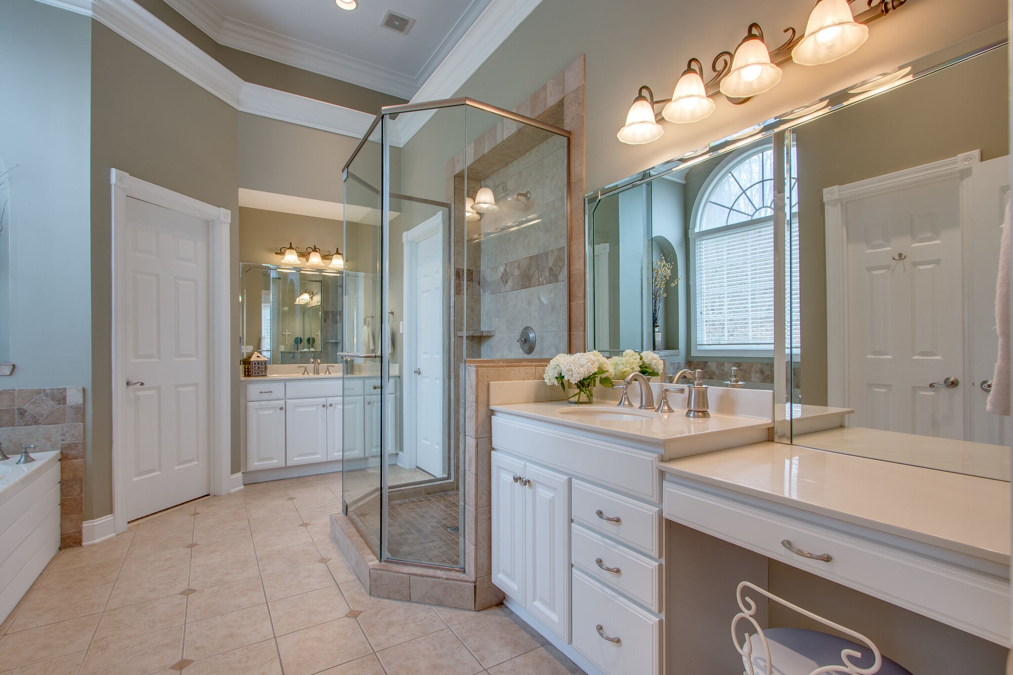 416 Sandcastle Road Franklin, TN 37069 - Photo 32 of 57 a spacious bathroom with a granite countertop sink a mirror and a shower