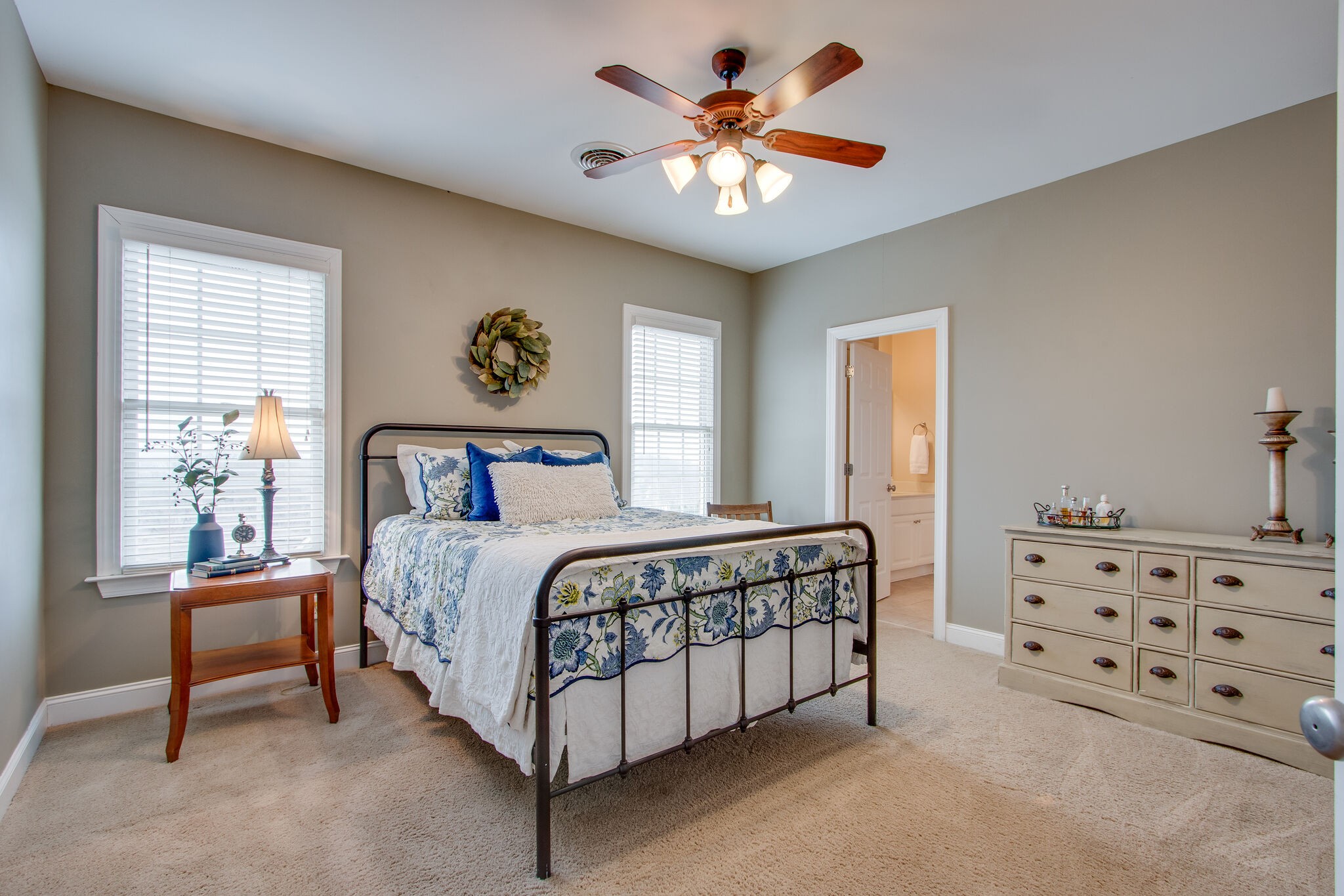 416 Sandcastle Road Franklin, TN 37069 - Photo 43 of 57 a bedroom with a bed and a chandelier