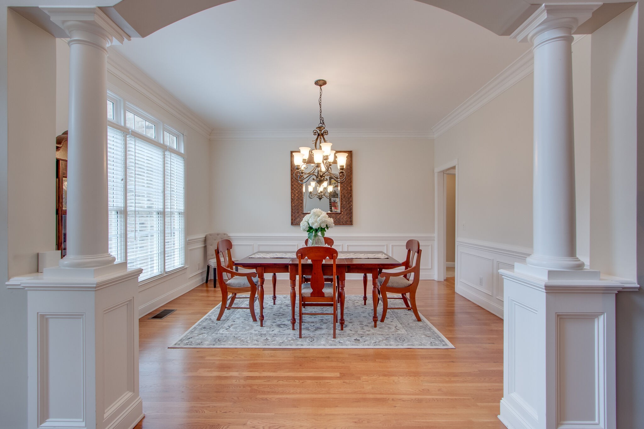 416 Sandcastle Road Franklin, TN 37069 - Photo 9 of 57 a dining room with furniture a chandelier and wooden floor