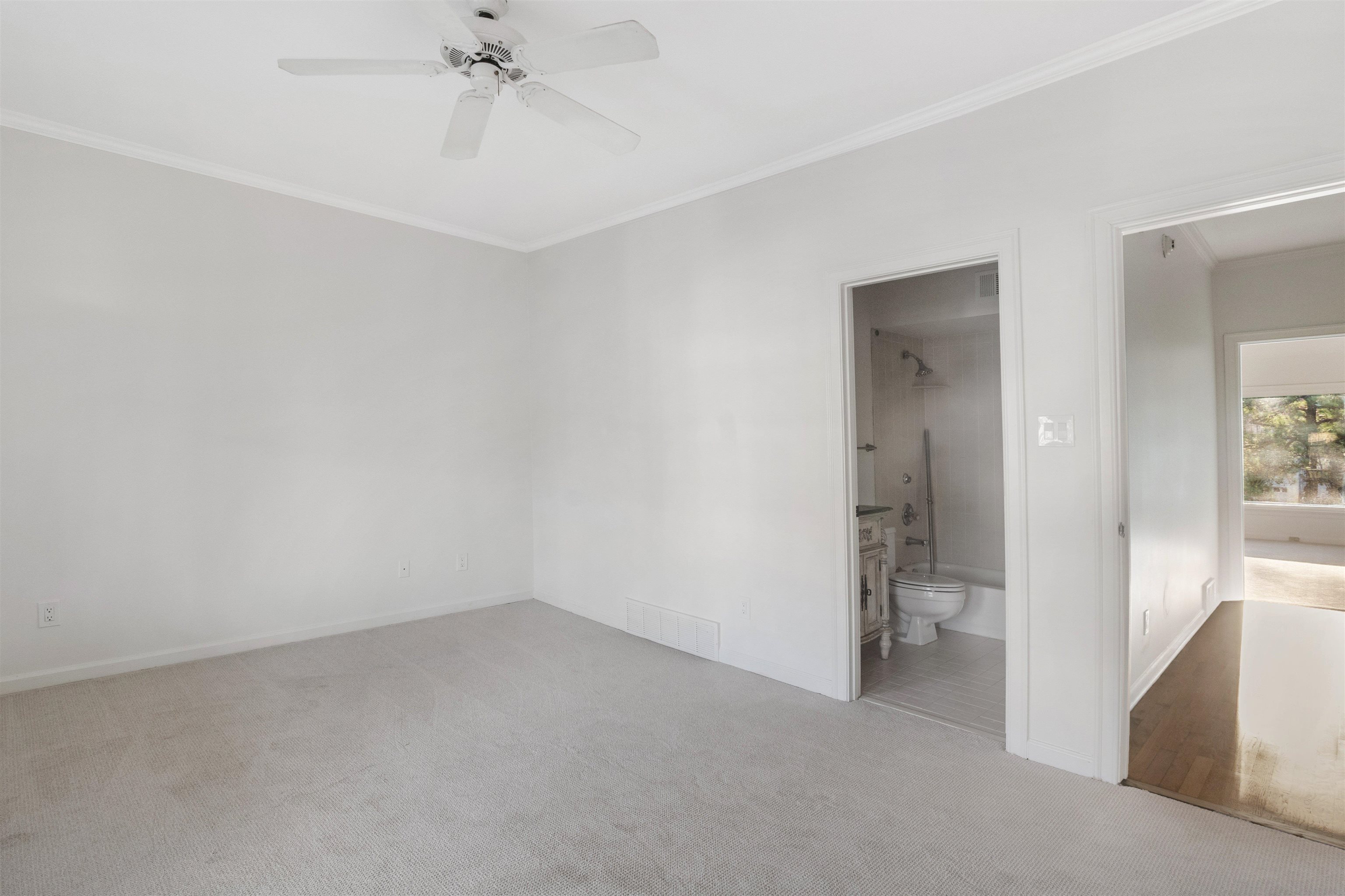 931 Harbor View Drive Memphis, TN 38103 - Photo 16 of 21 wooden floor in an empty room and a bathroom