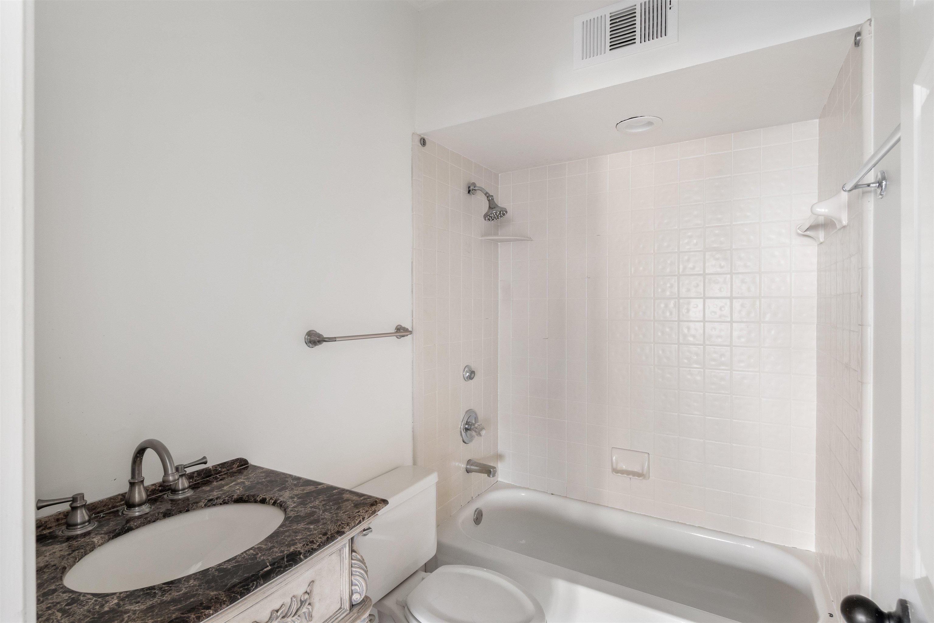 931 Harbor View Drive Memphis, TN 38103 - Photo 17 of 21 a bathroom with a sink and a mirror
