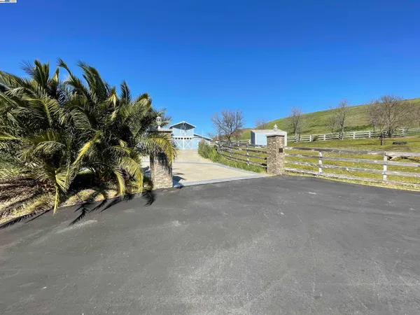 a view of an outdoor space and basketball court