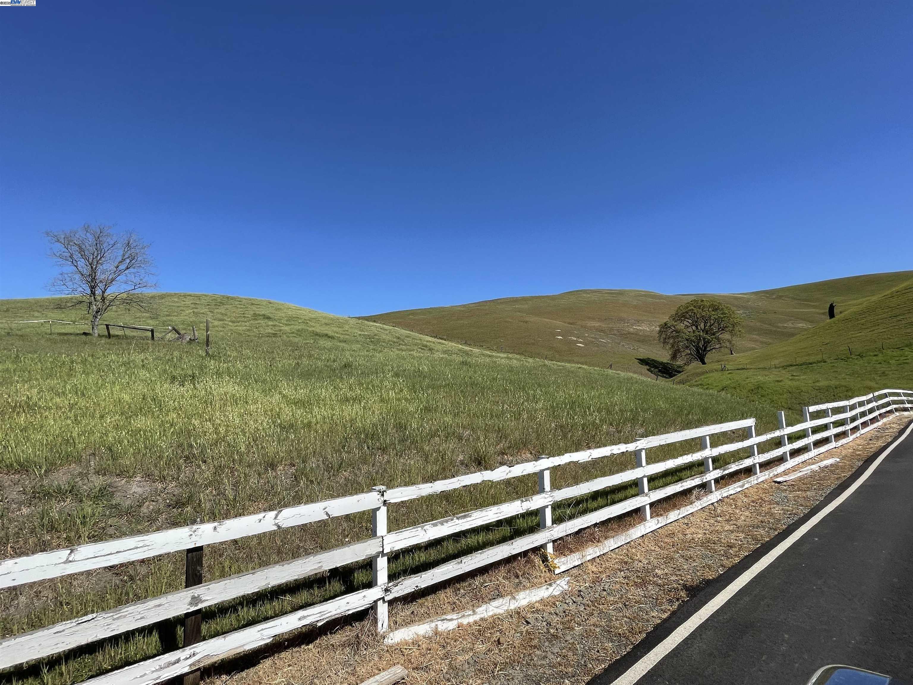 3343 Little Valley Road Sunol, CA 94586 - Photo 19 of 23 a view of a green field with wooden fence
