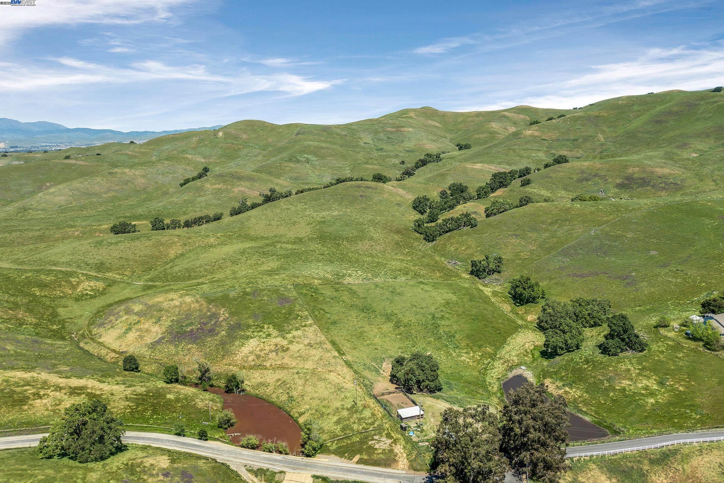 3343 Little Valley Road Sunol, CA 94586 - Photo 6 of 23 a view of a lake with a mountain