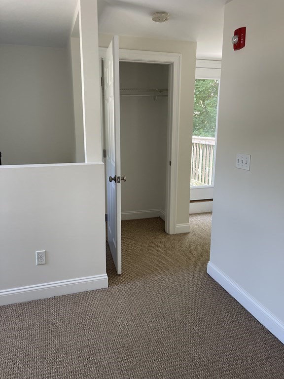 26 Main Street, Unit REAR Framingham, MA 01702 - Photo 5 of 11 an empty room with windows