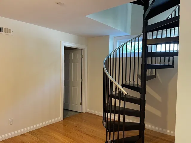 a view of entryway with wooden floor