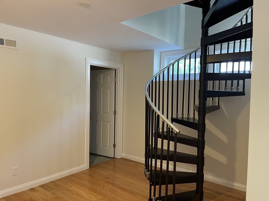 26 Main Street, Unit REAR Framingham, MA 01702 - Photo 8 of 11 a view of entryway with wooden floor