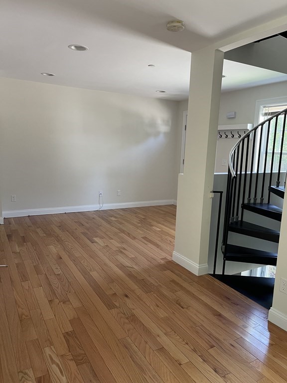 26 Main Street, Unit REAR Framingham, MA 01702 - Photo 10 of 11 wooden floor in an empty room